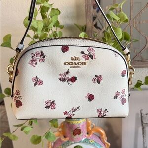 Coach Madi crossbody bag with floral and ladybug print